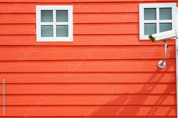 Fototapeta surveillance Cameras on red wall background