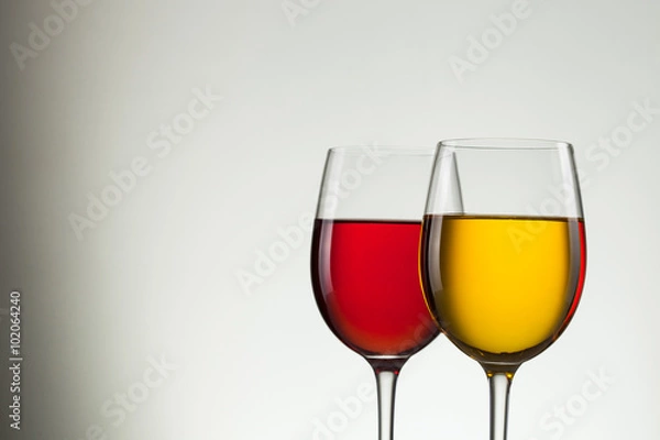 Fototapeta Glass of wine and bottle on white with copy space