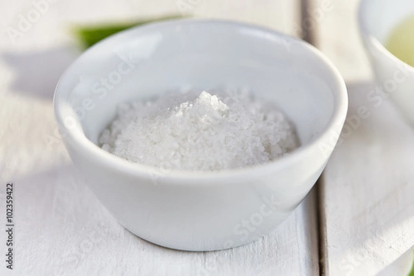 Fototapeta Sea salt in a white dish