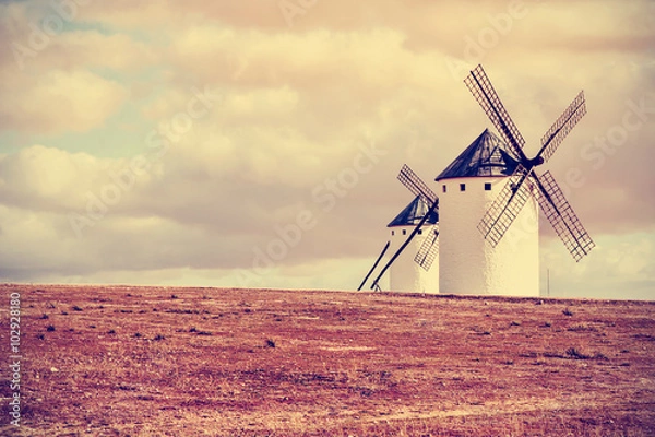 Fototapeta old windmills in Campo de Criptana, Spain, filtered