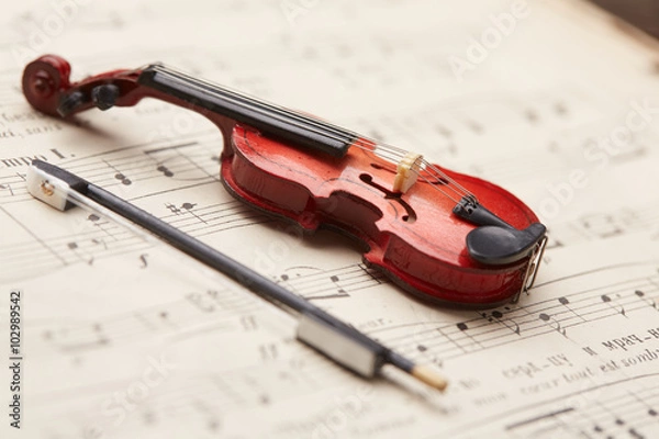 Fototapeta violin on of notes background