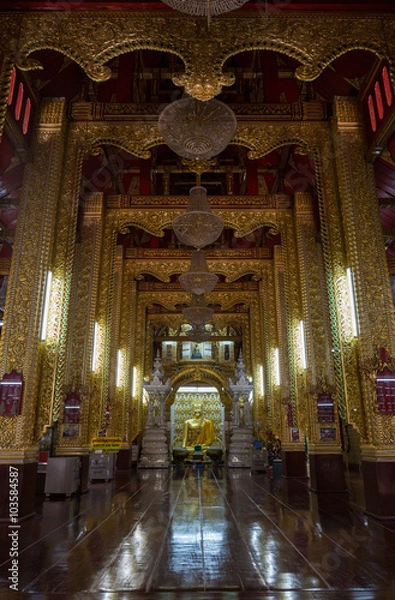 Fototapeta golden buddha statue on buddhism church temple