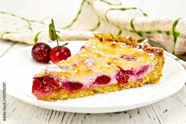 Fototapeta Pie cherry with sour cream in plate on light board