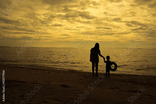 Fototapeta mother and son by on the sea