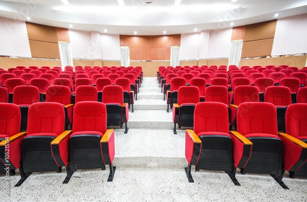 Fototapeta rows of red chairs in auditorium