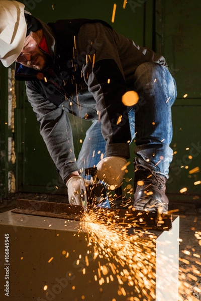 Fototapeta Worker working of a grinding machine