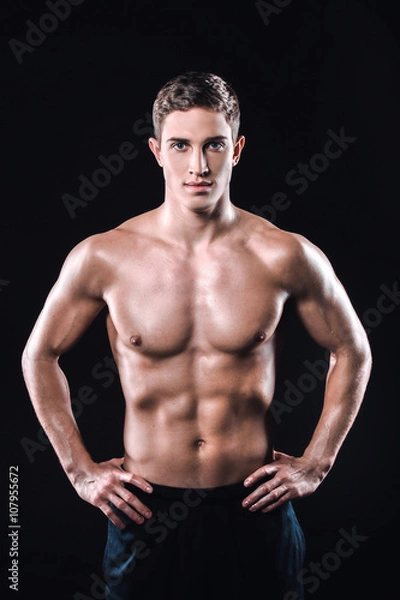 Fototapeta Fitness boy on black background