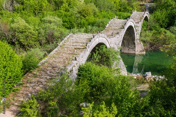 Fototapeta Old stone bridge of Plakidas, Kipoi (Greece)