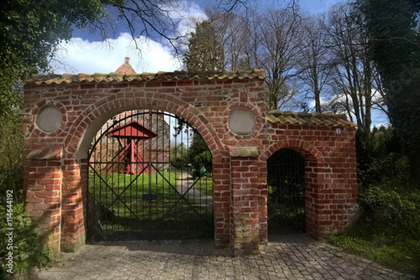 Fototapeta Cemetery with church and bell frame in Weitenhagen, Germany