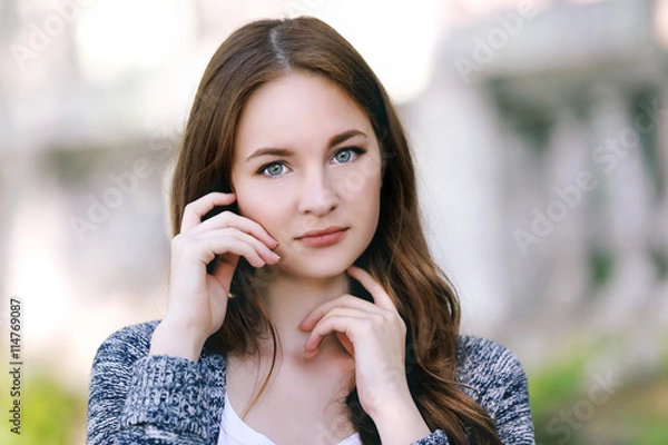 Fototapeta Portrait of beautiful girl in park