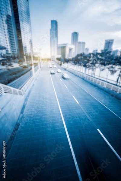 Fototapeta City road with moving traffic,tianjin china.