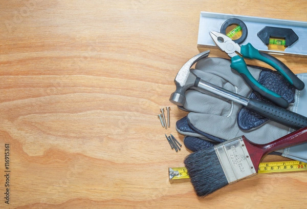 Fototapeta Tools on a wooden background