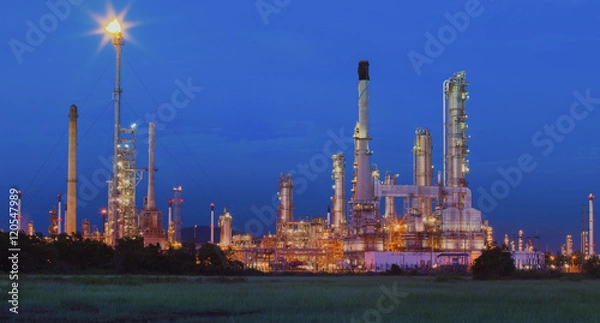 Fototapeta beautiful lighting of oil refinery in petrochemical industry est