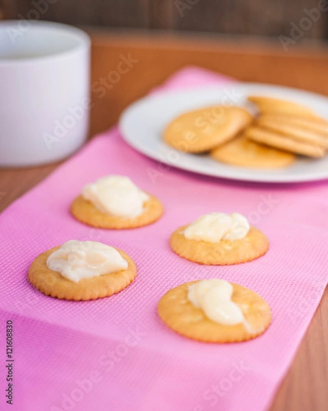 Fototapeta crackers biscuits on wooden background