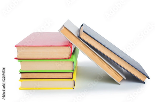 Fototapeta stack of multicolored books. on white, isolated background.