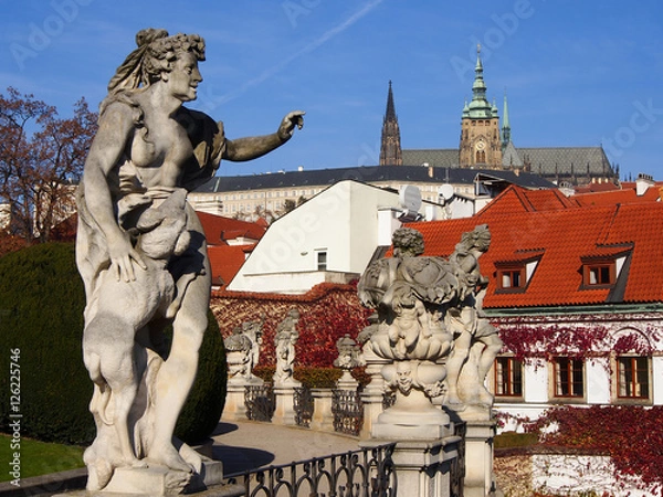 Fototapeta Sculpture in Vrtbovska Garden, view of the Prague castle