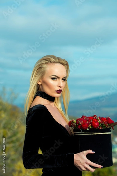 Fototapeta Pretty girl with flowers in box