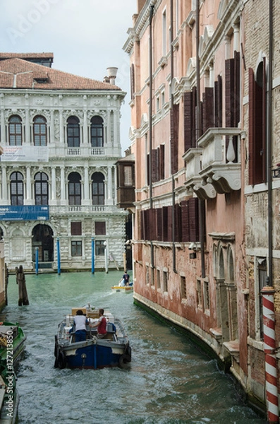 Fototapeta Boats on narrow Venice channel