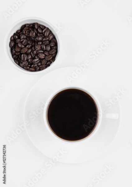 Fototapeta Cup of black  coffee for breakfast with beans