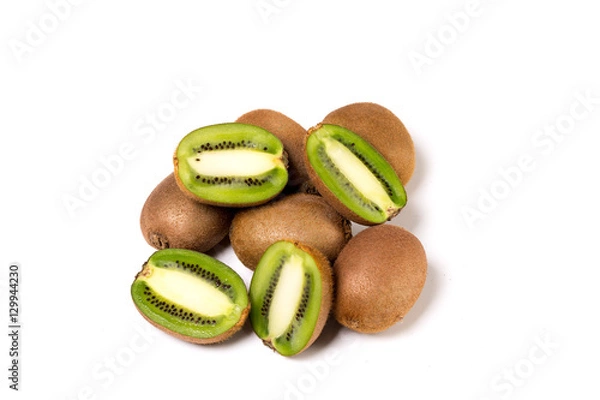 Fototapeta Whole kiwi fruit and his sliced segments isolated on white background cutout