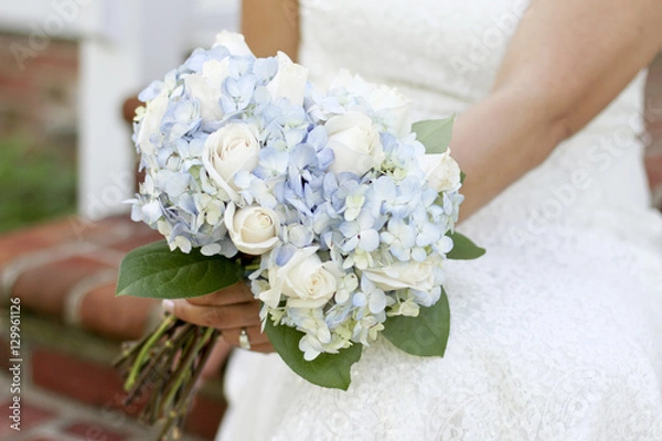 Fototapeta Bride Holding Bouquet of White Roses and Blue Hydrangea