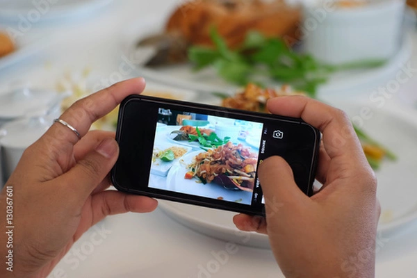 Obraz Using hands to take food's picture by smart phone.