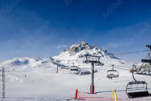 Fototapeta Ski lift in mountains at winter