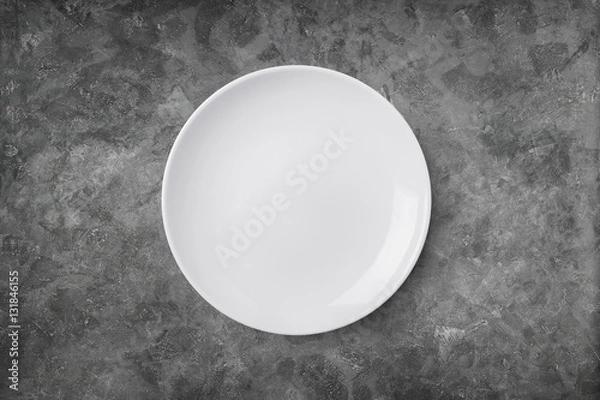 Fototapeta Empty plate on cement background. Top view with clipping path