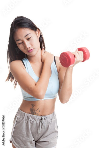 Fototapeta Asian healthy girl got shoulder pain with dumbbell.