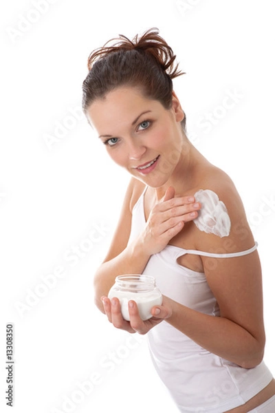 Fototapeta Body care series - Beautiful young woman applying cream