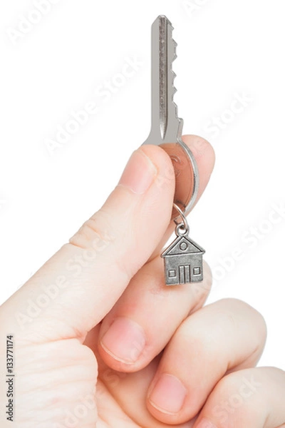 Fototapeta Keys with a charm in a hand.