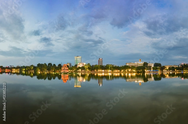 Fototapeta Hoan Kiem lake panorama view at sunset period with ancient Turtle Tower and Hanoi post office (Buu Dien Ha Noi in Vietnamese) . Hoan Kiem lake (Sword lake or Ho Guom) is center of Hanoi