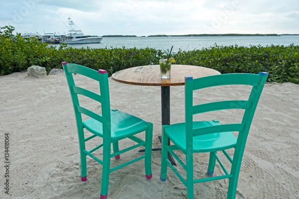 Obraz Table With Drink Colorful Chairs Relaxing Vacation Restaurant Concept Florida Keys