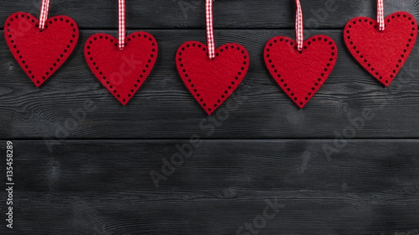 Fototapeta red hearts on the black rustic wooden background with woodgrain texture