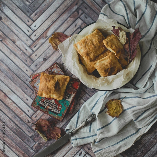 Fototapeta Crispy patties of puff pastry closeup rustic