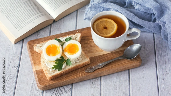 Fototapeta breakfast with boiled eggs and crispy toasts, closeup