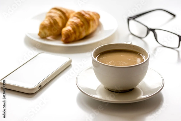 Fototapeta Breakfast for businessman with coffee and croissant on white table