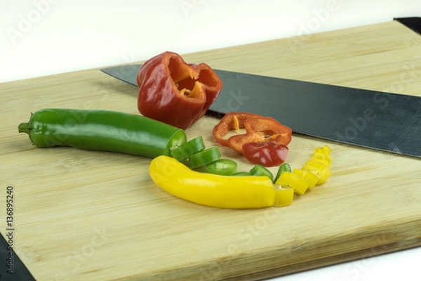 Obraz Sliced chili peppers on cutting board