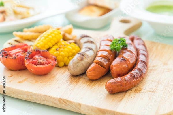 Fototapeta mix grilled sausage with vegetables and french fries