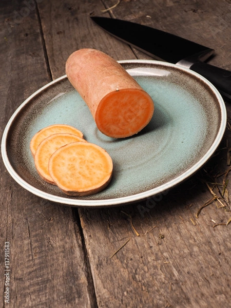 Fototapeta Batata on a rustic plate