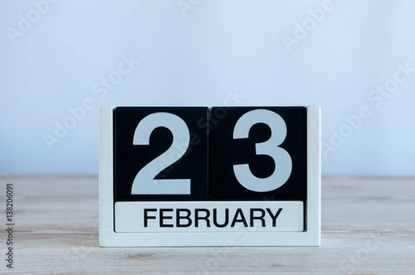 Fototapeta February 23rd. Day 23 of month, daily calendar on wooden table background. Winter time. Empty space for text