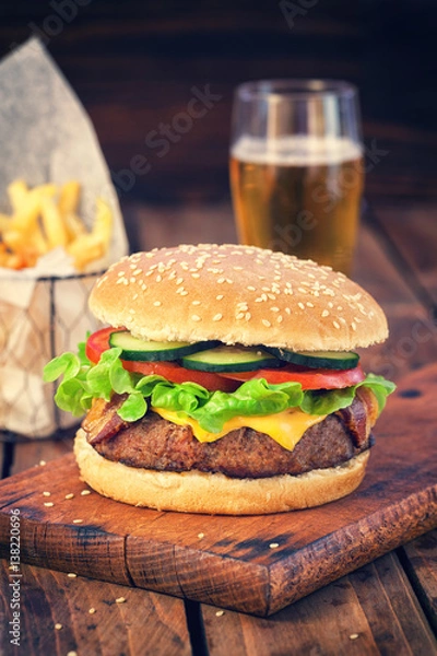 Fototapeta American Burger with bacon,cheese,tomato,lettuce,french fries and beer