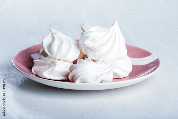 Fototapeta Heap of fluffy meringue on the plate