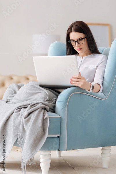 Fototapeta Pleasant brunette woman working at home