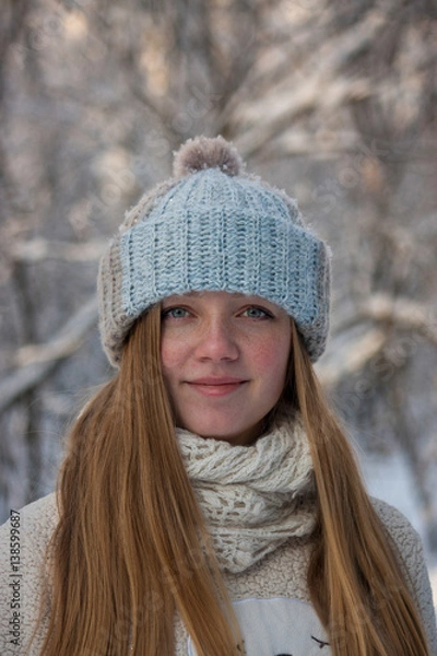 Fototapeta beautiful girl in a knitted hat