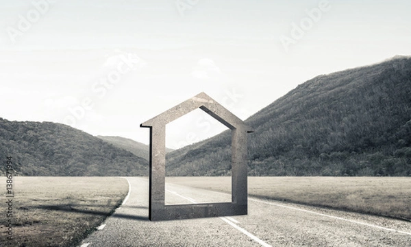 Fototapeta Conceptual background image of concrete home sign on asphalt roa