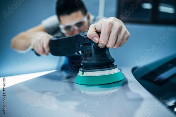 Fototapeta Doing a car polish