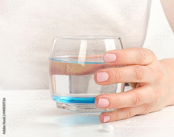 Fototapeta Young Woman holding glass of water.