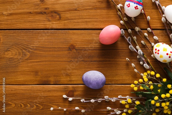 Fototapeta Colorful easter eggs on wood background