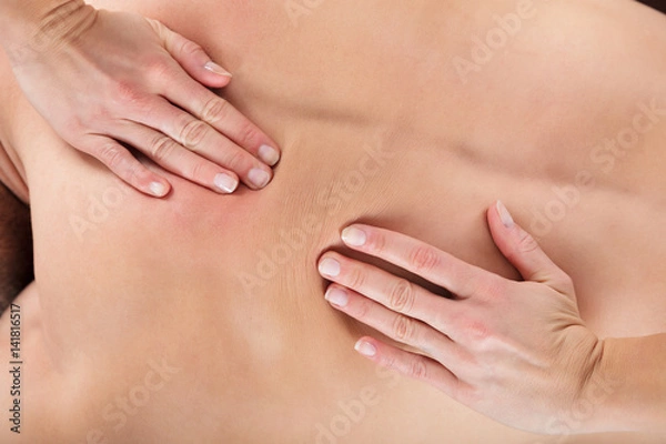 Fototapeta Masseur Giving A Relaxing Back Massage